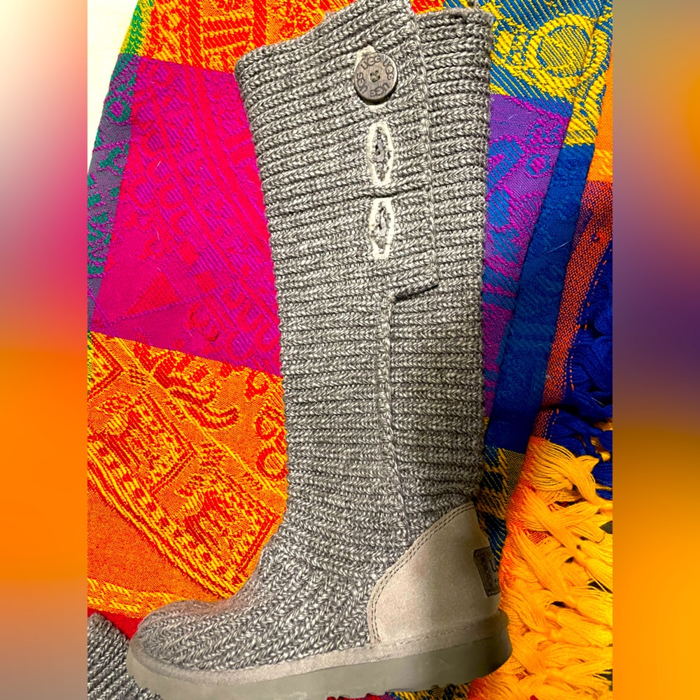 Brand new UGG Cardy Tall knit boots with buttons. Foldable shaft. Never worn.